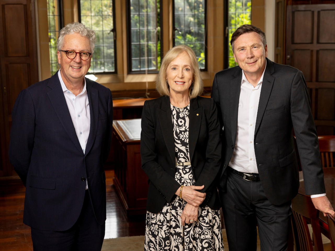 An image of three people standing together