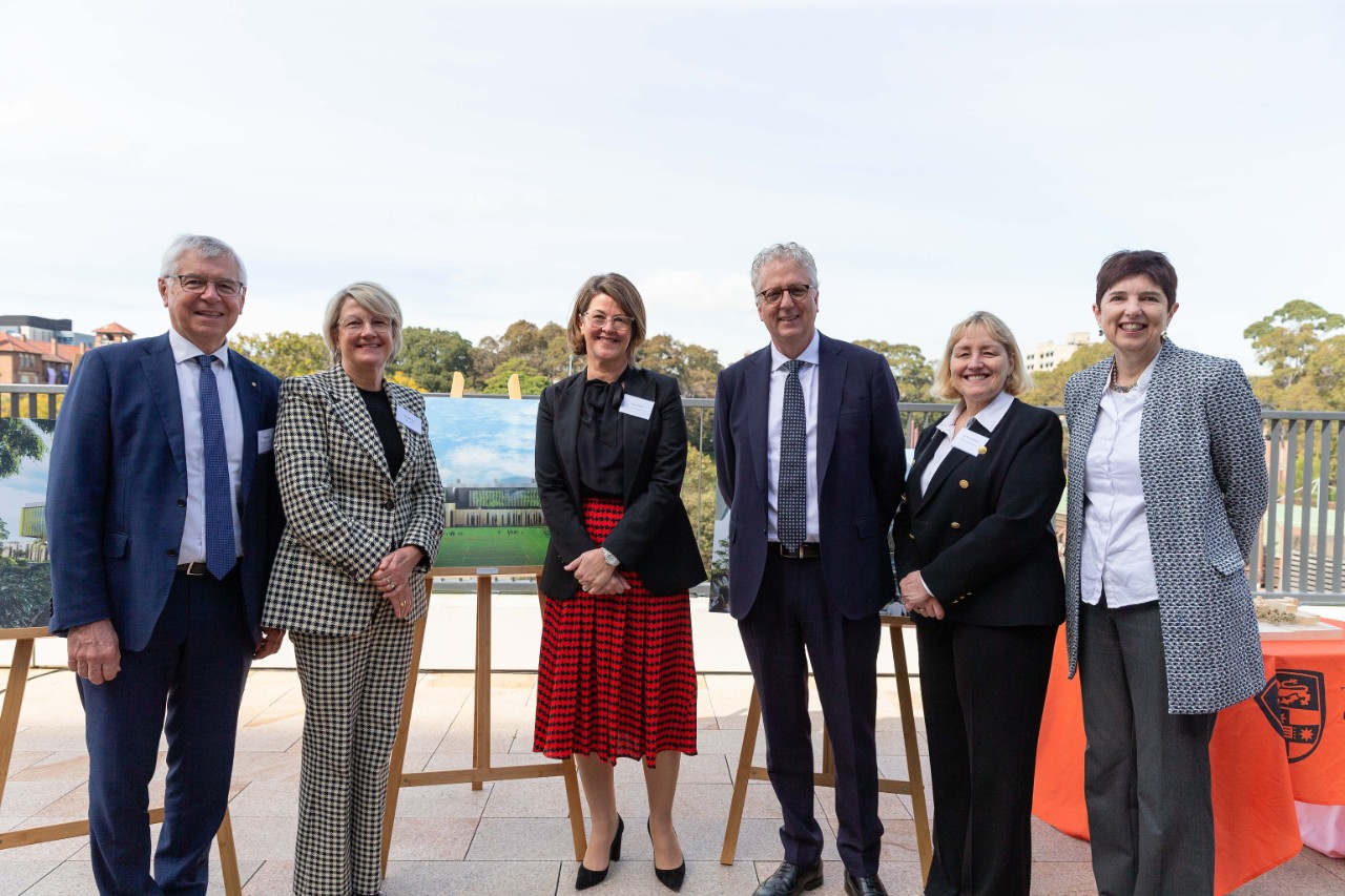 Stakeholders gather together outdoors at the launch event 
