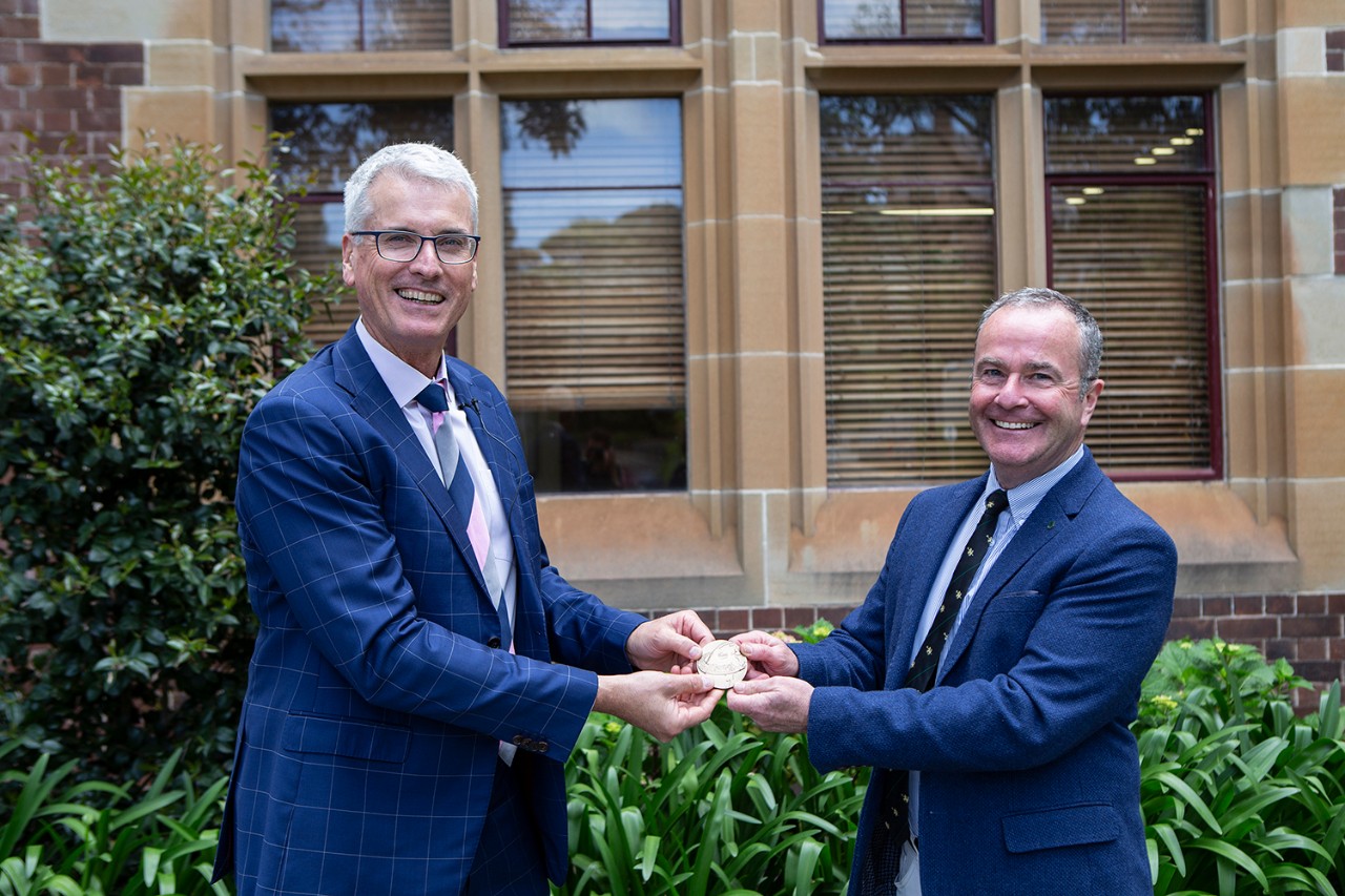 photo of Professor Frazer Allan congratulating Professor Paul McGreevy