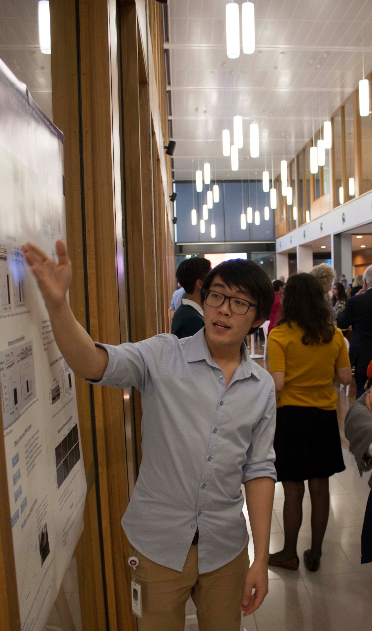 Student explaining a project at the event launch at Westmead.