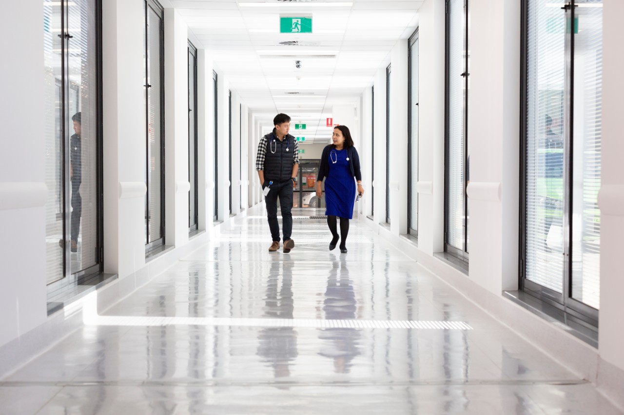 Clinicians walking in hospital