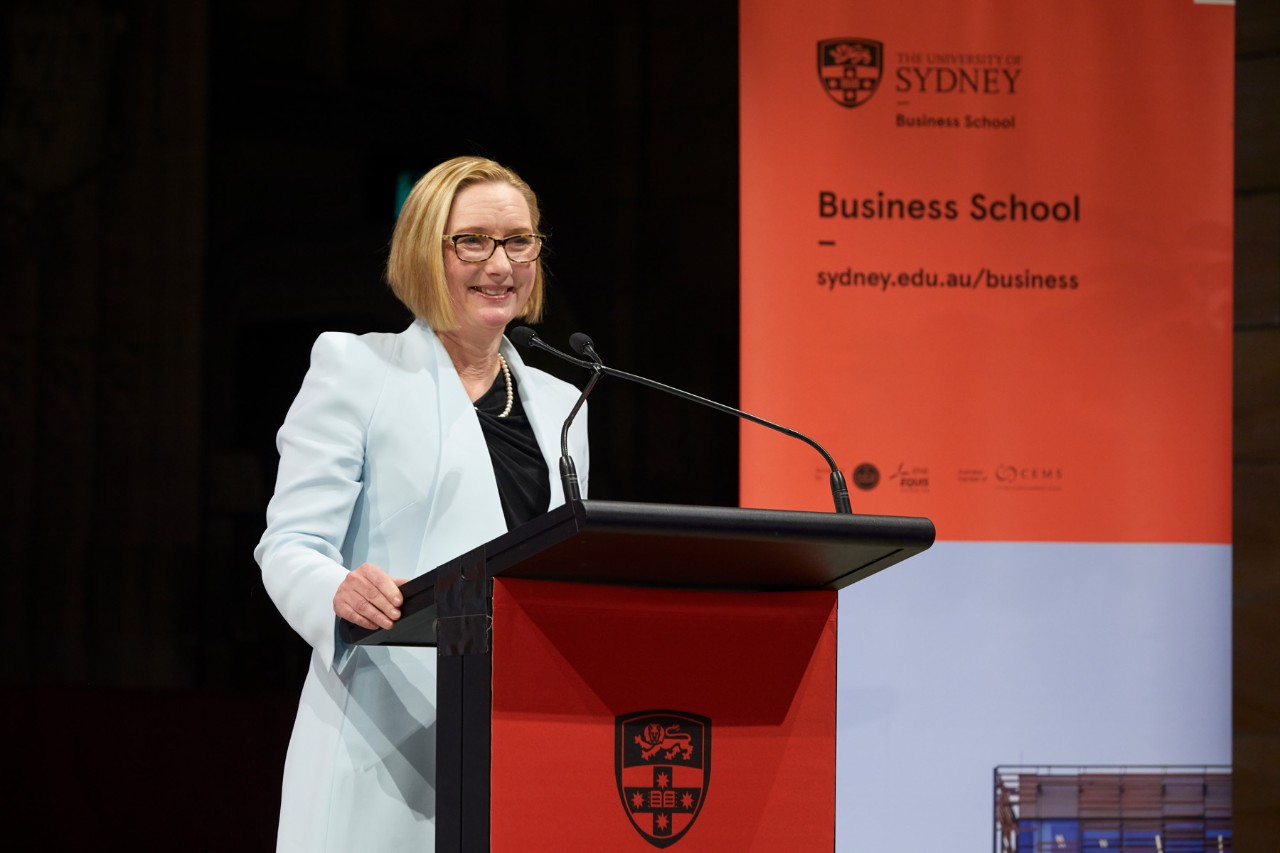 Susan Lloyd-Hurwitz speaking at alumni dinner