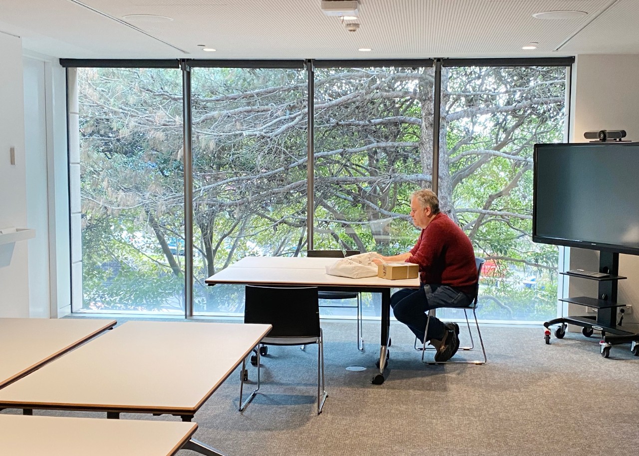 Craig Barker sitting at a desk