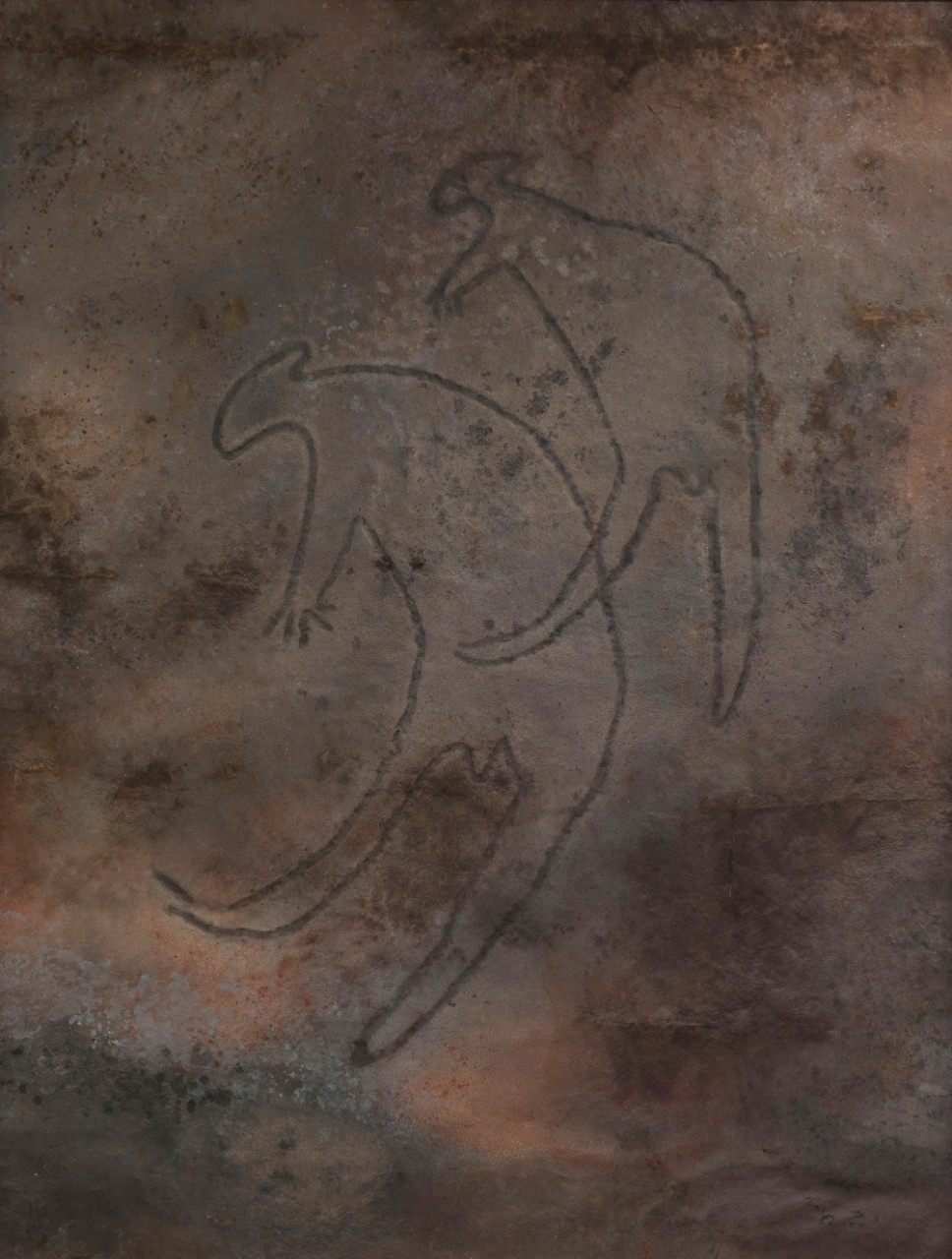 Two wallabies engraved into rock. 