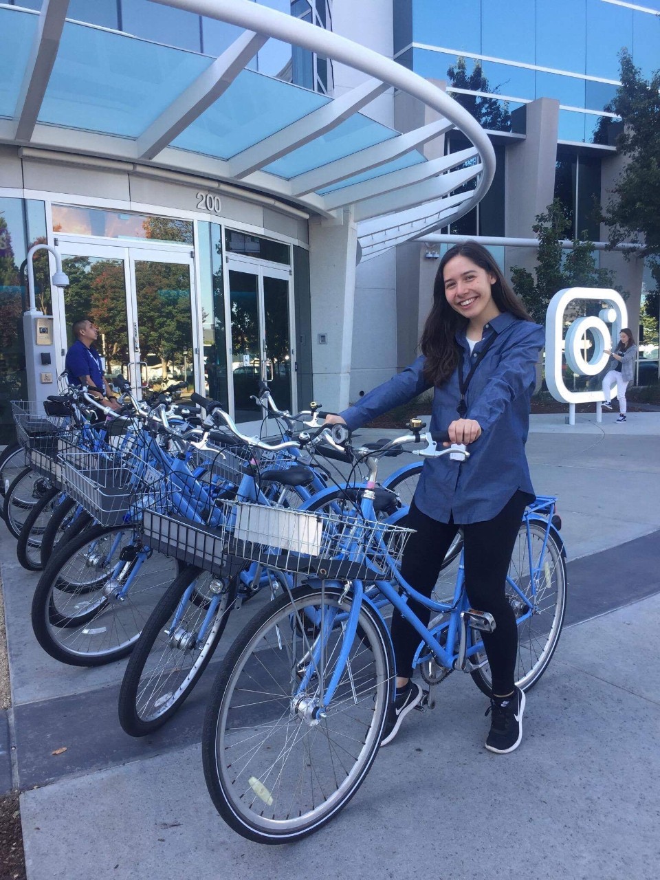 Indonesian Studies grad, Anastasia Pavlovic, speaking on stage at a conference