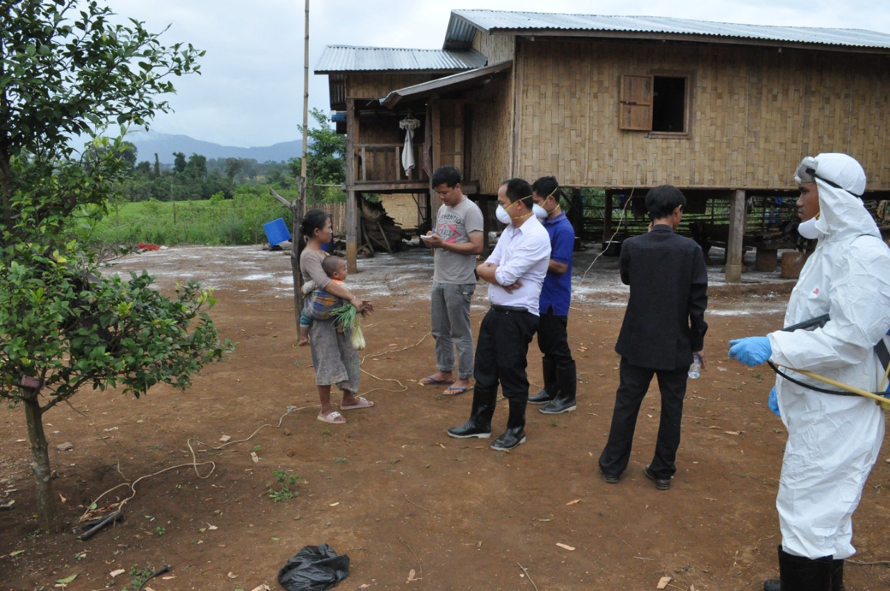District staff answer concerns raised by a resident in a village declared a ‘Red Zone’ in the outbreak