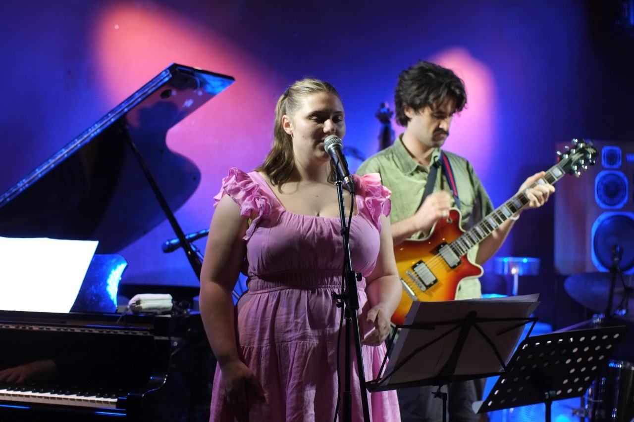 Sarah Vandenberg performing on stage. 