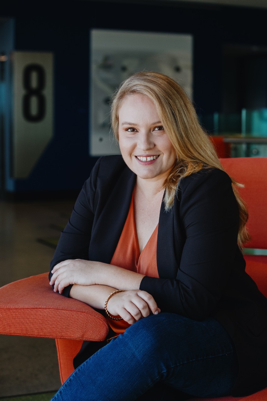 Louise Thornton sitting and smiling at the camera