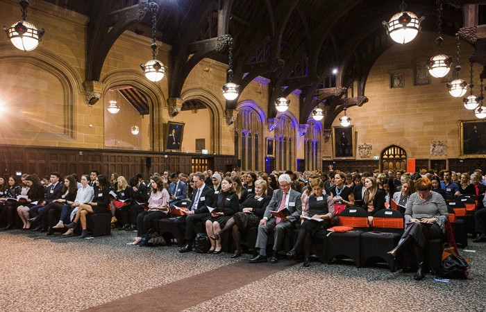 Audience of many in seated attendance at MacLaurin Hall