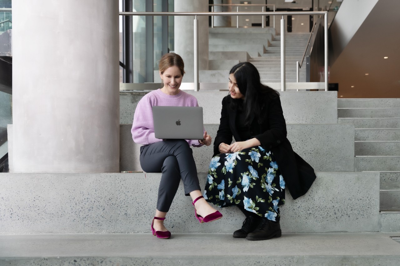 Dr Stephanie Partridge (left) working with a research student.