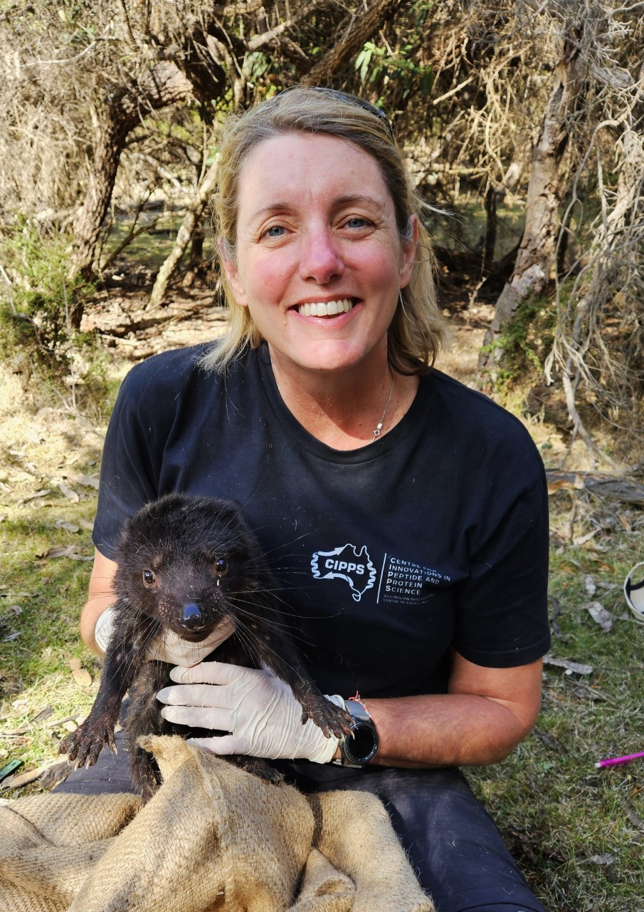 Carolyn Hogg holding a Tasmanian Devil