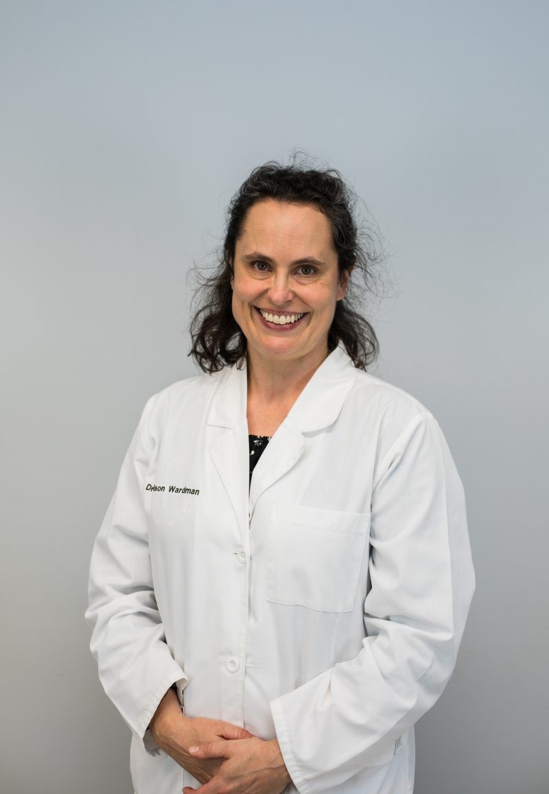 Image of Dr Alison Wardman in a white lab coat.