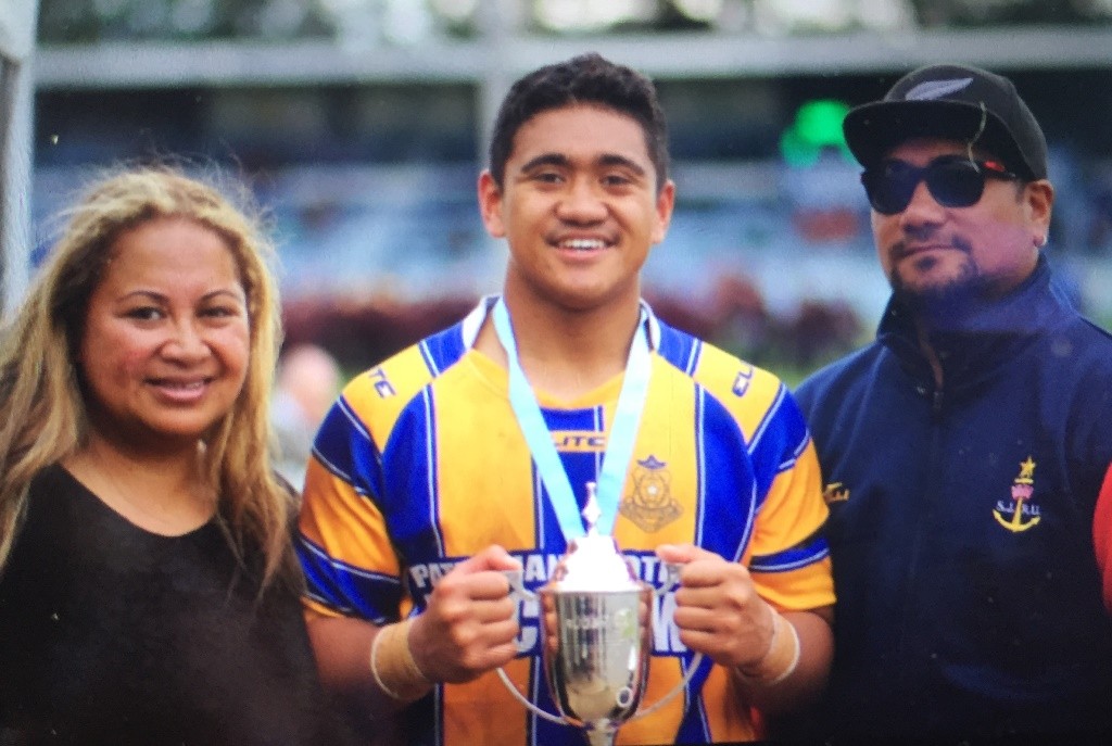 Delahoya Manu with rugby trophy