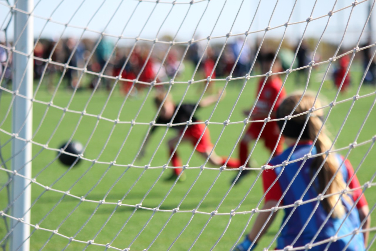 Image of girls playing soccer. Photo: Alyssa Ledesma / Unsplash.