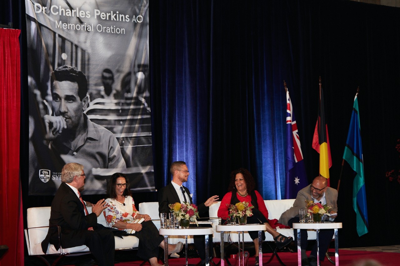 A photo of the panel with moderator Daniel Browning