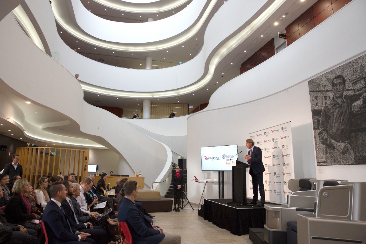 A photo of Professor Stephen Simpson speaking.