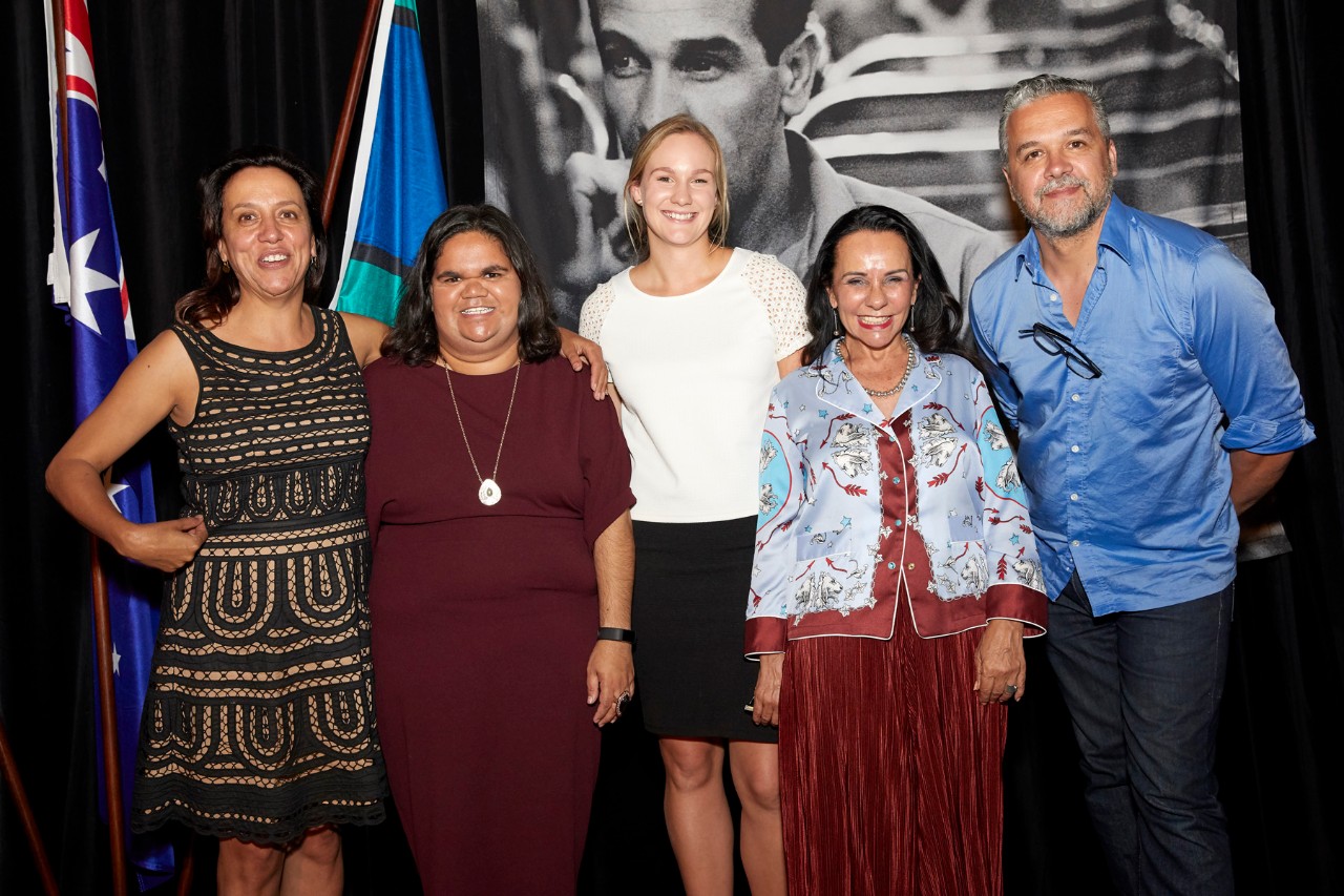 A group shot of people on stage