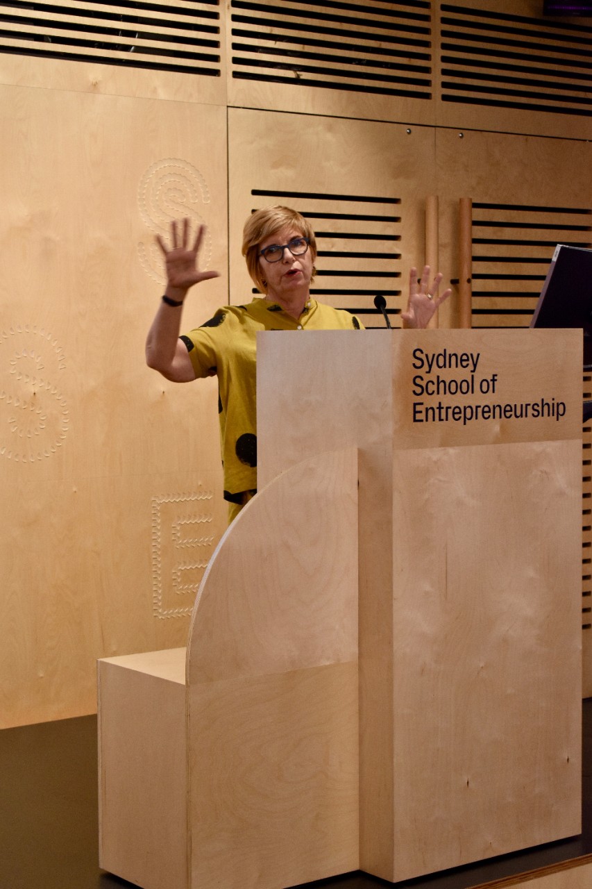 Professor Leanne Cutcher speaks at the final pitch night.