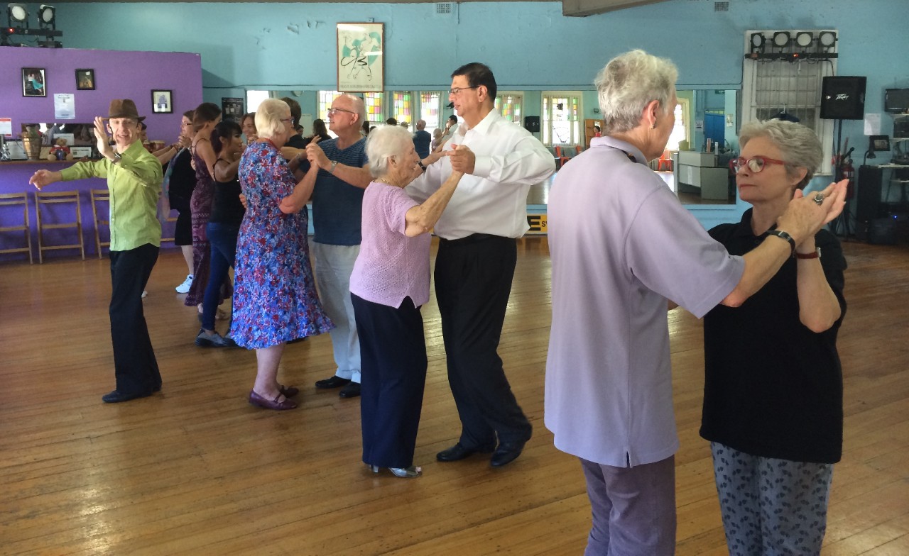 Instructor with dance class