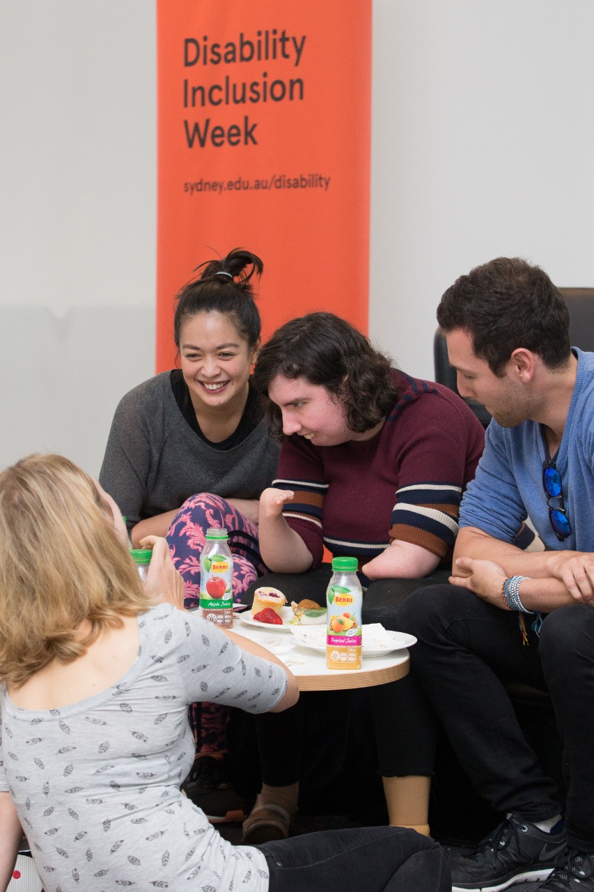 Students talking around a table at Disability Inclusion Week