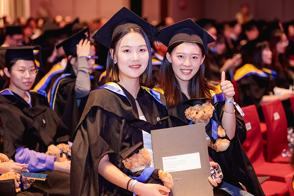 University of Sydney graduates attending a ceremony in China.